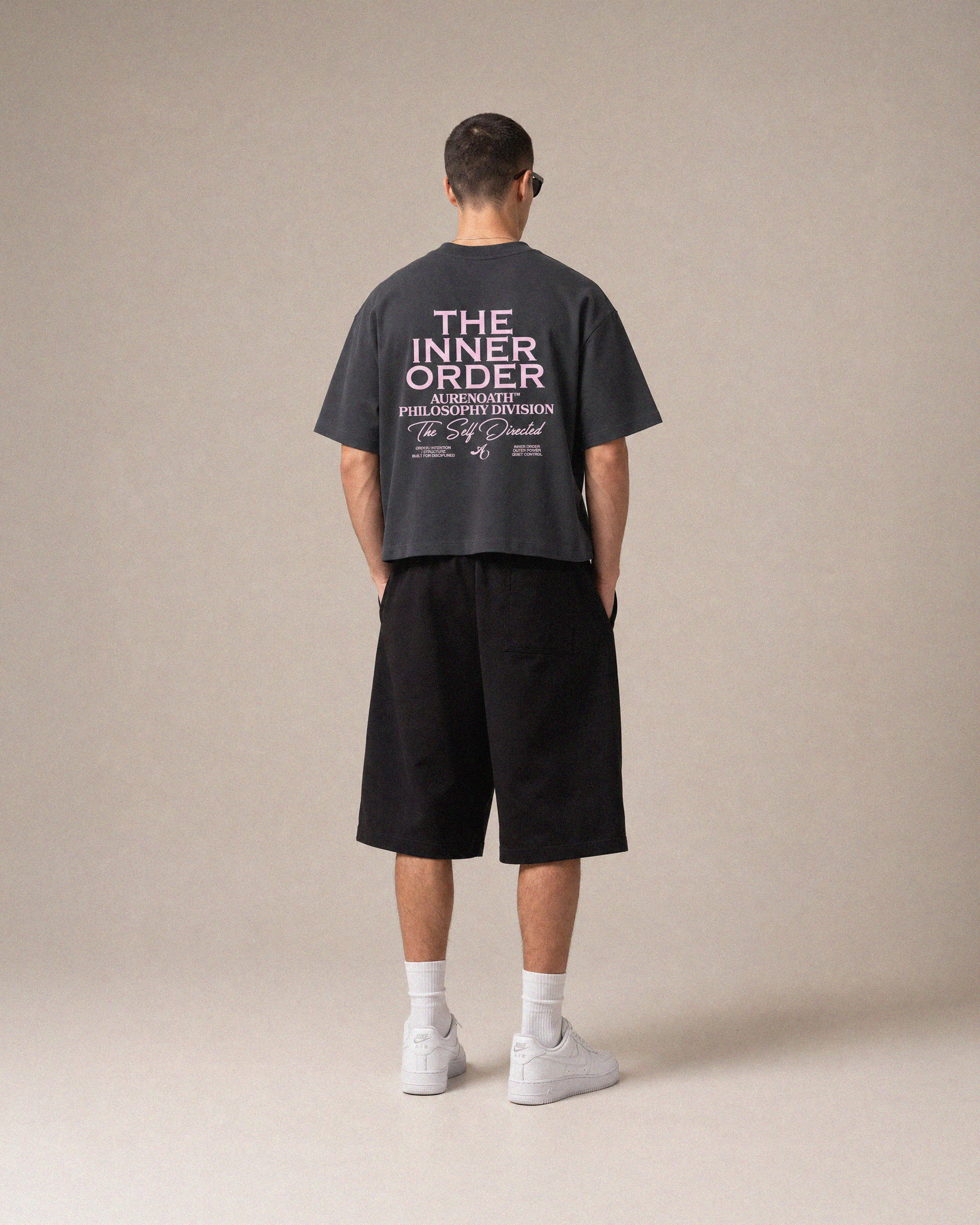 AURENOATH Auren Tee charcoal back view with The Inner Order Philosophy Division graphic in pink