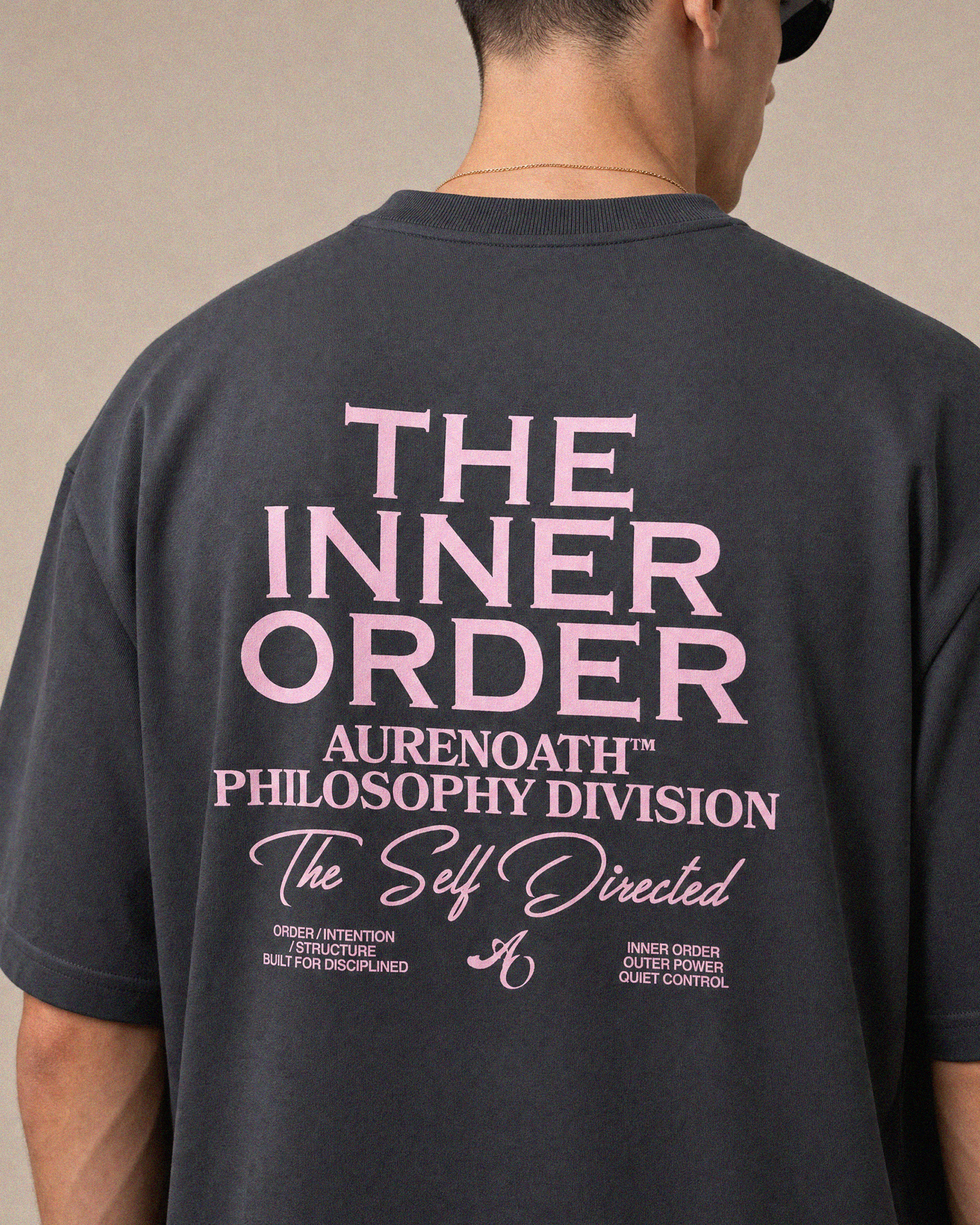 AURENOATH Auren Tee charcoal back view with The Inner Order Philosophy Division graphic in pink